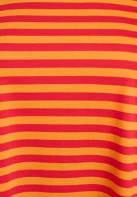 Red and yellow striped fabric with even horizontal lines. The texture appears smooth and soft, indicating a stretchy material.