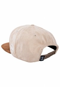 Beige suede cap with a brown brim, featuring white logo embroidery on the side and adjustable strap at the back. Textured fabric finish.