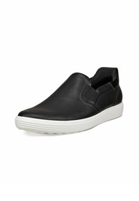 Scarpa nera in pelle senza lacci con pannelli elastici laterali, suola in gomma bianca e texture liscia. Presenta una punta arrotondata e un design minimalista.