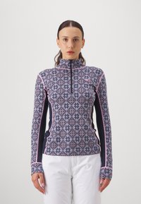 Langermet, halv-zip termisk topp i marineblå med diamant- og snøfnugg mønstre i rosa og lyseblå. Har kontrastfargede sidepaneler og sømmer.
