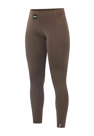 Bruine geribde legging met een hoge tailleband, voorzien van een zijzak en een zwart logo-tag op het onderbeen. Gemaakt van rekbaar materiaal.