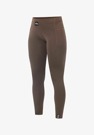 Brown ribbed leggings with a high waistband, featuring a side pocket and a black logo tag on the lower leg. Made from stretchy material.