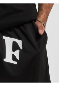 DEF PRINT  - Jogginghose - black