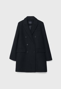 Manteau en laine noir à double boutonnage avec larges revers, deux poches avant à rabat, et manches longues, présenté sur un fond clair uni.