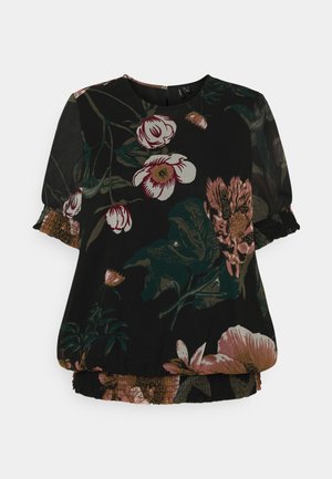 Blouse noire avec grand imprimé floral rose et blanc, manches bouffantes transparentes avec poignets élastiques, et ourlet élastiqué.