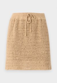 Strikket beige skjørt med en teksturert, åpen vevdesign. Har strikk i midjen for justerbarhet. Nedre kant er rett.