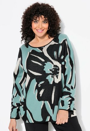 Pull en tricot avec un motif floral en noir, turquoise et crème. Il a une coupe décontractée, des manches longues et un col rond large.