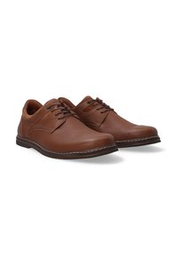Bruine leren schoenen met een gladde afwerking, vetersluiting, contrasterende stiksels, ronde neus en een lage rubberen zool.
