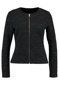Giacca nera con zip realizzata in tessuto testurizzato, con scollatura rotonda e maniche lunghe, dalla silhouette aderente e dettagli in zip argentata.
