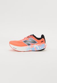 Bright coral running shoes with a mesh upper, metallic logo, and patterned sole in blue and pink. Lightweight design for comfort and speed.