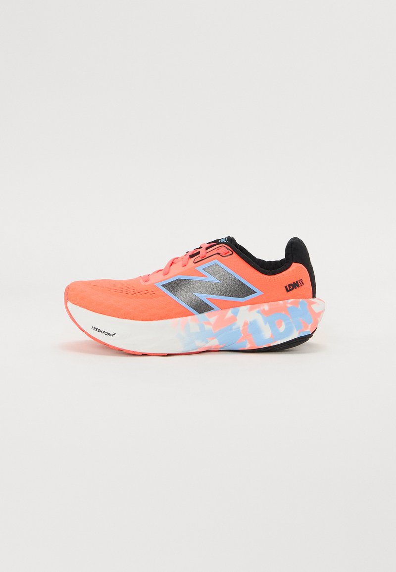 Bright coral running shoes with a mesh upper, metallic logo, and patterned sole in blue and pink. Lightweight design for comfort and speed.