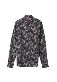 Chemise à manches longues et à boutons en tissu noir avec un motif floral coloré. Comprend un empiècement au dos avec un petit accent brodé.