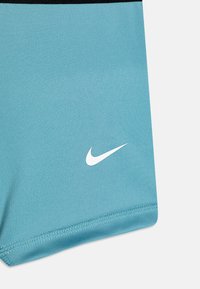 Nike Performance UNISEX - Sport rövidnadrágok - denim turquoise/white