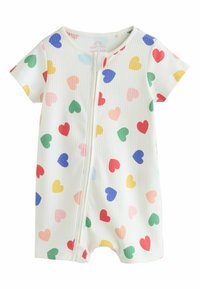 Barboteuse blanche à manches courtes pour bébé, avec motifs de cœurs multicolores et une fermeture éclair centrale à l'avant.