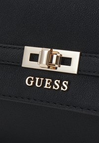 Guess EMILEE CONVERTIBLE XBODY FLAP - Borsa a tracolla - black