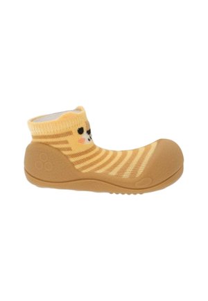 Scarpa morbida per bambino con suola in gomma e parte superiore a calza a righe gialle con un volto di gatto sorridente sul polsino della caviglia.