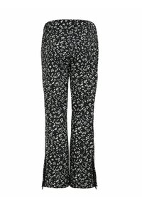 Zwarte broek met een wit bloemenpatroon, met een wijd benen ontwerp en zijritsen aan de zoom. Zacht, lichtgewicht stof.