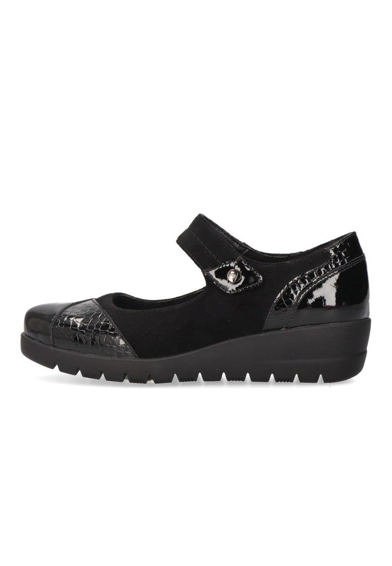 Zapatos Mary Jane negros con puntera y talón de charol texturizado, parte superior de ante y una correa de Velcro para un ajuste seguro.