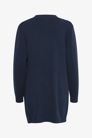 Jersey de punto azul marino de manga larga con puños y dobladillo acanalados, visto desde atrás.