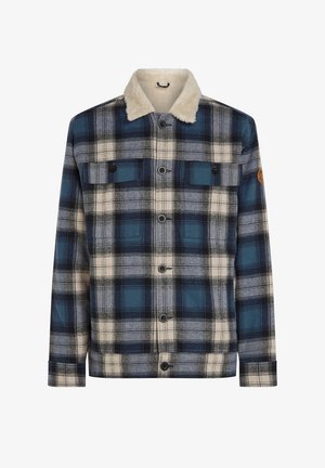 Veste à carreaux avec un schéma de couleurs bleu et crème, dotée d'un col en fausse fourrure, de deux poches poitrine et de fermetures à bouton.