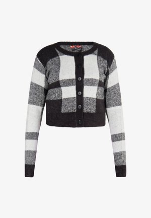 Zwart-wit geblokte cropped cardigan van textuur gebreide stof. Heeft een ronde hals en zes zwarte knopen aan de voorkant.