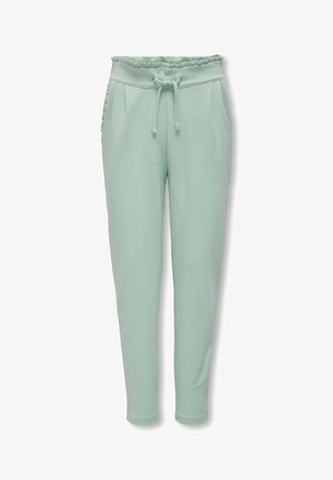 Pantalones jogger verde claro hechos de material suave, con cinturilla elástica fruncida, cordón ajustable y bolsillos laterales.