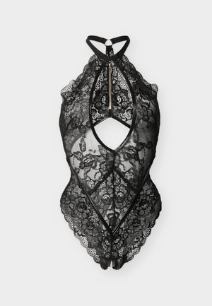 Body en dentelle noire à col licou avec motifs floraux, ouverture en forme de goutte à l'avant, fermeture éclair et bords festonnés, présenté sur un fond uni.