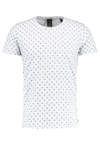 Hvid bomulds t-shirt med rund hals, korte ærmer og et gentaget blåt blomstermønster over hele. Blød tekstur, afslappet design.