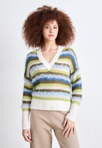 Multicolored striped sweater in fuzzy texture with a V-neck and ribbed cuffs. Colors include blue, green, brown, and cream.