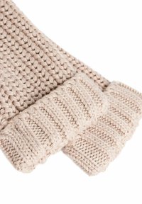 Strickfingerlose Handschuhe in hellem Beige. Mit gerippten Säumen und einem strukturierten Gewebe. Weiche Wolle mit einem gemütlichen Aussehen.