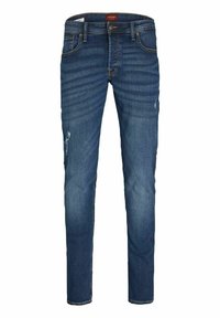 Jean skinny bleu en denim avec une légère décoloration, accents déchirés, cinq poches et fermeture à bouton.