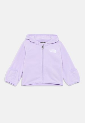 Veste en polaire lilas avec capuche, fermeture éclair à l'avant et détail de logo. Présente des manches à poignets et une texture douce.