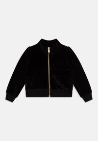 Giacca bomber in velluto nero con zip dorata, colletto alto, due tasche frontali e polsini a costine. Texture morbida con design aderente.