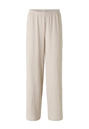 Kremowe, teksturowane spodnie o luźnym kroju z elastycznym pasem, prostymi nogawkami i miękką, pomarszczoną tkaniną.