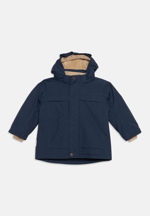 Navy blue hooded jacket with beige fleece lining, front snap buttons, and long sleeves laid flat on a white background.