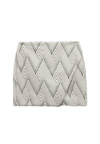 Clutch tas met een geometrisch zwart-wit zigzagpatroon, gemaakt van textuurstof, met een geplooid ontwerp aan de voorkant.