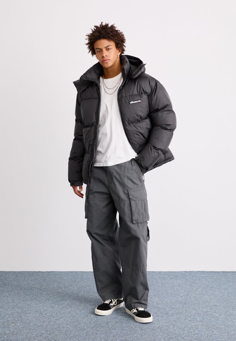 ellesse Monterini padded 1/4 zip jacket in black | ASOS