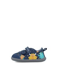 Zapato infantil azul marino con dos correas de velcro, que presenta gráficos de monstruos coloridos, suela de goma gris y un tirador en el talón reforzado.
