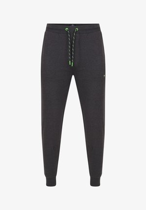 Donkergrijze sweatpants van zacht materiaal, met een elastische tailleband en groene aantrekkoorden, en geribbelde manchetten. Kleine logo-detail aan de zijkant.