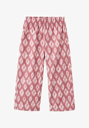 Pantalon rose ample avec motif ikat blanc en forme de losange et taille élastique.