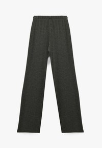 Dunkelgraue, gerippte, weit geschnittene Hose mit elastischem Bund und glatter Textur, entworfen für Komfort und einen lässigen Sitz.