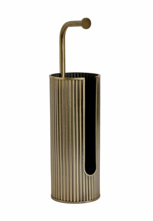 Tall cylindrical brass umbrella stand with vertical ridges and a curved handle extending from the top inside edge.