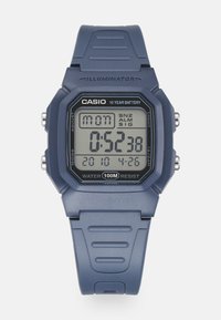 Digital wristwatch with a blue resin case and strap, featuring an LCD display. Notable details include water resistance up to 100 meters.
