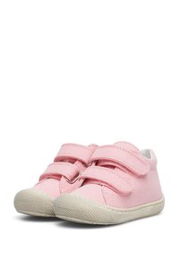 Pink canvas shoes with two Velcro straps, white rubber sole, rounded toe, and textured grip on the front for traction.