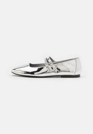 Silver metallic ballet flat with a pointed toe, dual adjustable straps, and smooth texture. Slim black sole for added contrast.