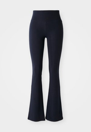 Navy blue flared leggings made from stretchy material with a high waist. Smooth texture and solid color, no visible patterns or accents.