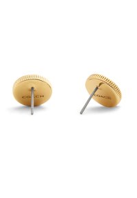 Gold-tone stud earrings with a textured edge and smooth surface, featuring a metal post and an engraved logo on one side.