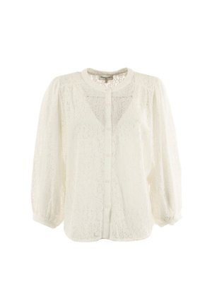 Blusa bianca in pizzo con scollatura rotonda, chiusura con bottoni frontale e maniche lunghe arricciate. Tessuto trasparente con intricate trame in pizzo.