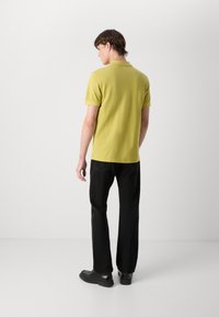 BOSS PRIME - Bluză polo - bright yellow