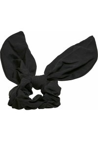 Svart tygscrunchie med två överdimensionerade, spetsiga kaninöron som detaljer. Mjuk textur med en snodd design i mitten, vilket skapar en bålignande look.
